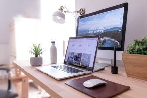 Laptop and desktop screen showing SEO data